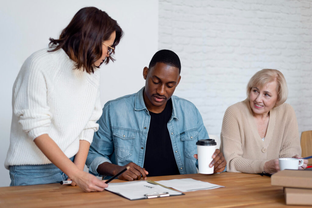 three people reviewing documents