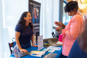 members meeting at event smiling